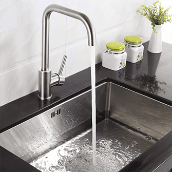 Hot water flowing into an empty kitchen sink disposal