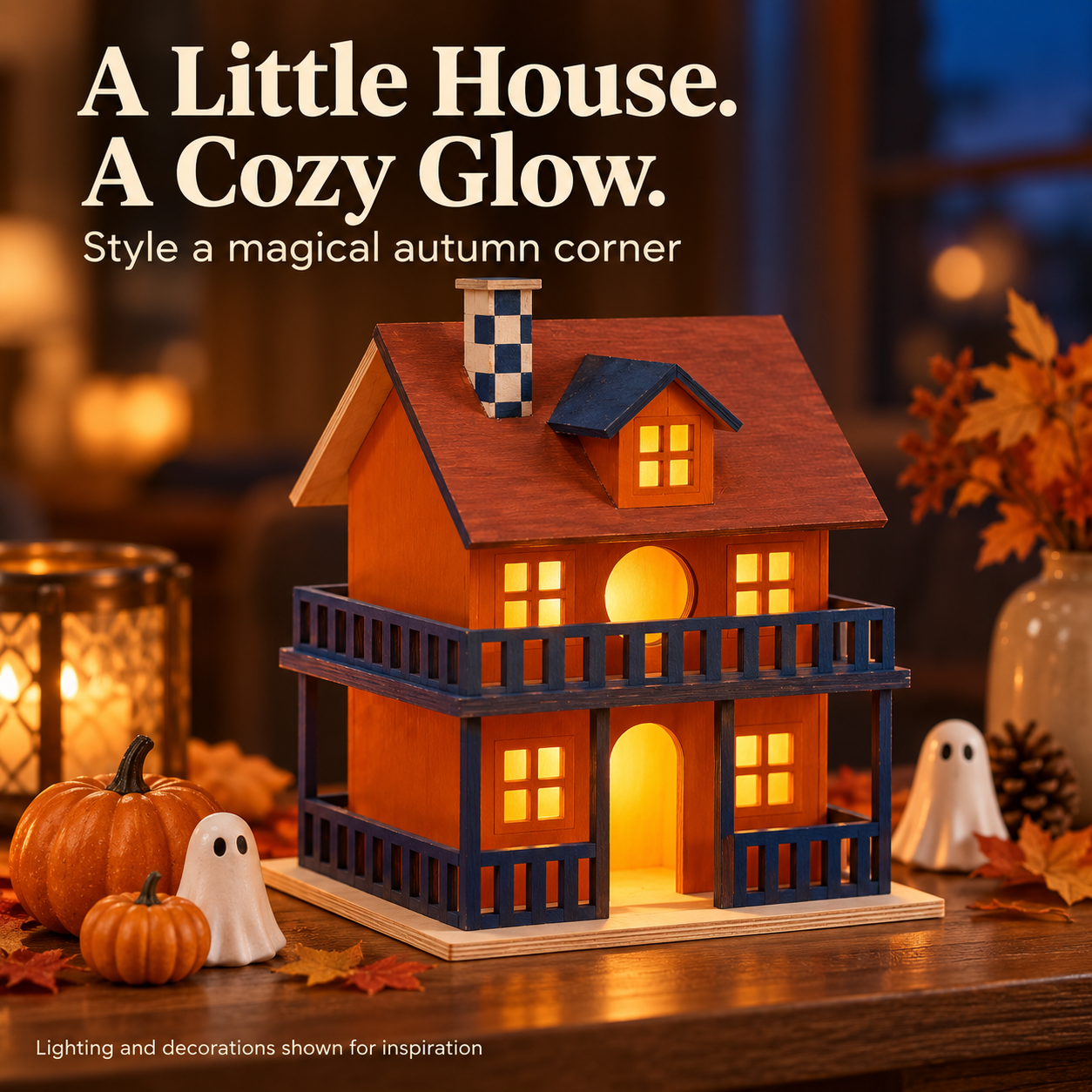 A painted miniature house in a cozy evening display with optional decorative lighting
