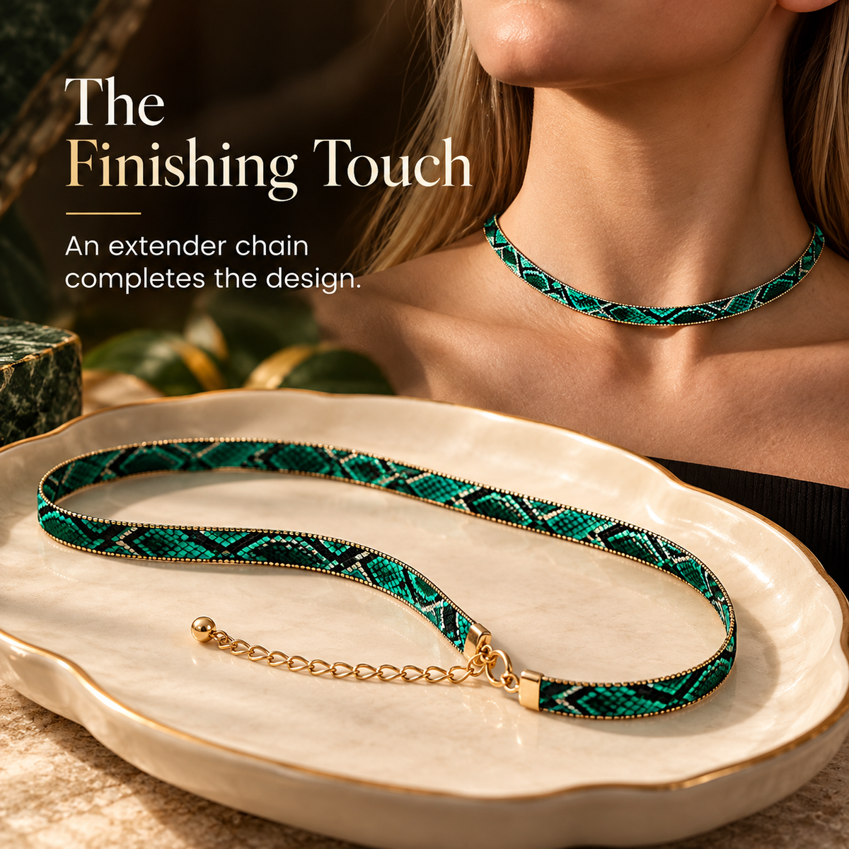 Gold-tone extender chain and clasp detail on the green statement necklace