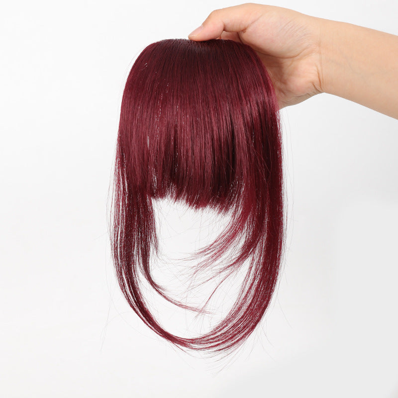Fake bangs hairpiece for the top of the head
