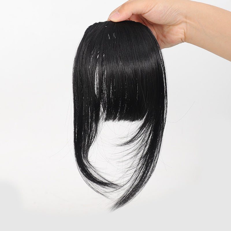 Fake bangs hairpiece for the top of the head