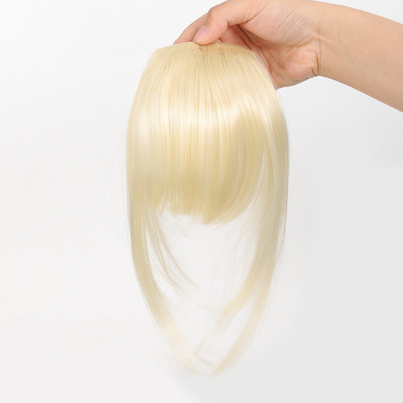 Fake bangs hairpiece for the top of the head