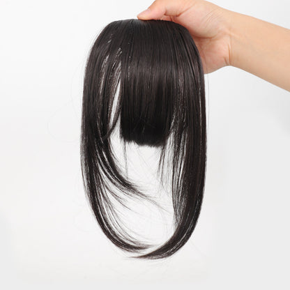 Fake bangs hairpiece for the top of the head
