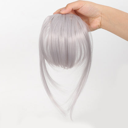 Fake bangs hairpiece for the top of the head