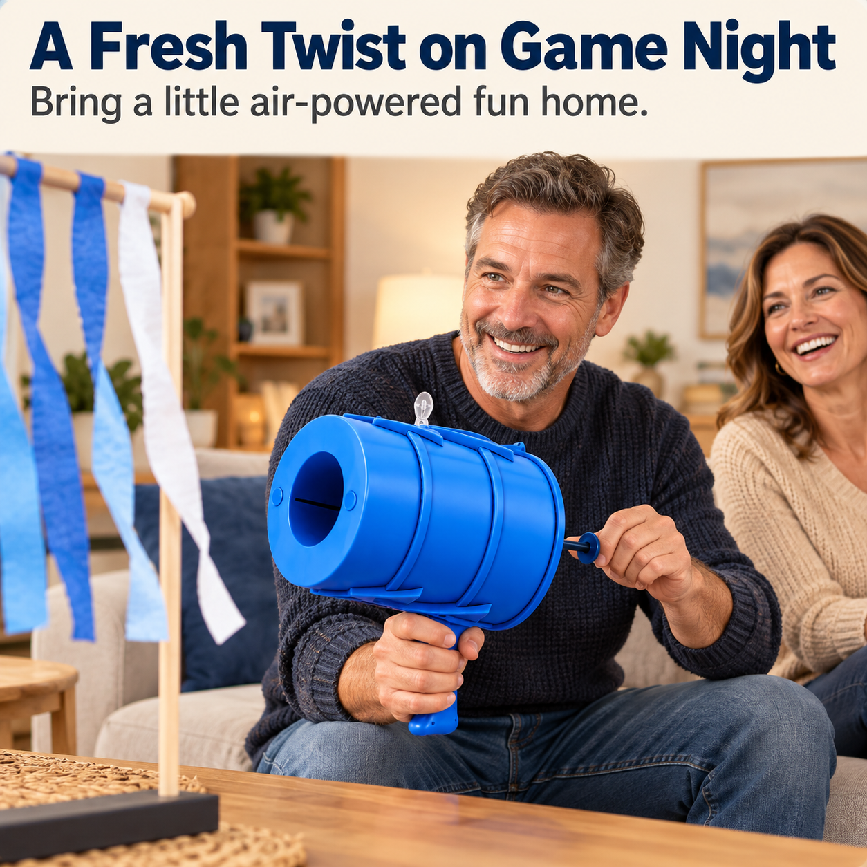Adults enjoying a blue manual air vortex toy during a relaxed game night