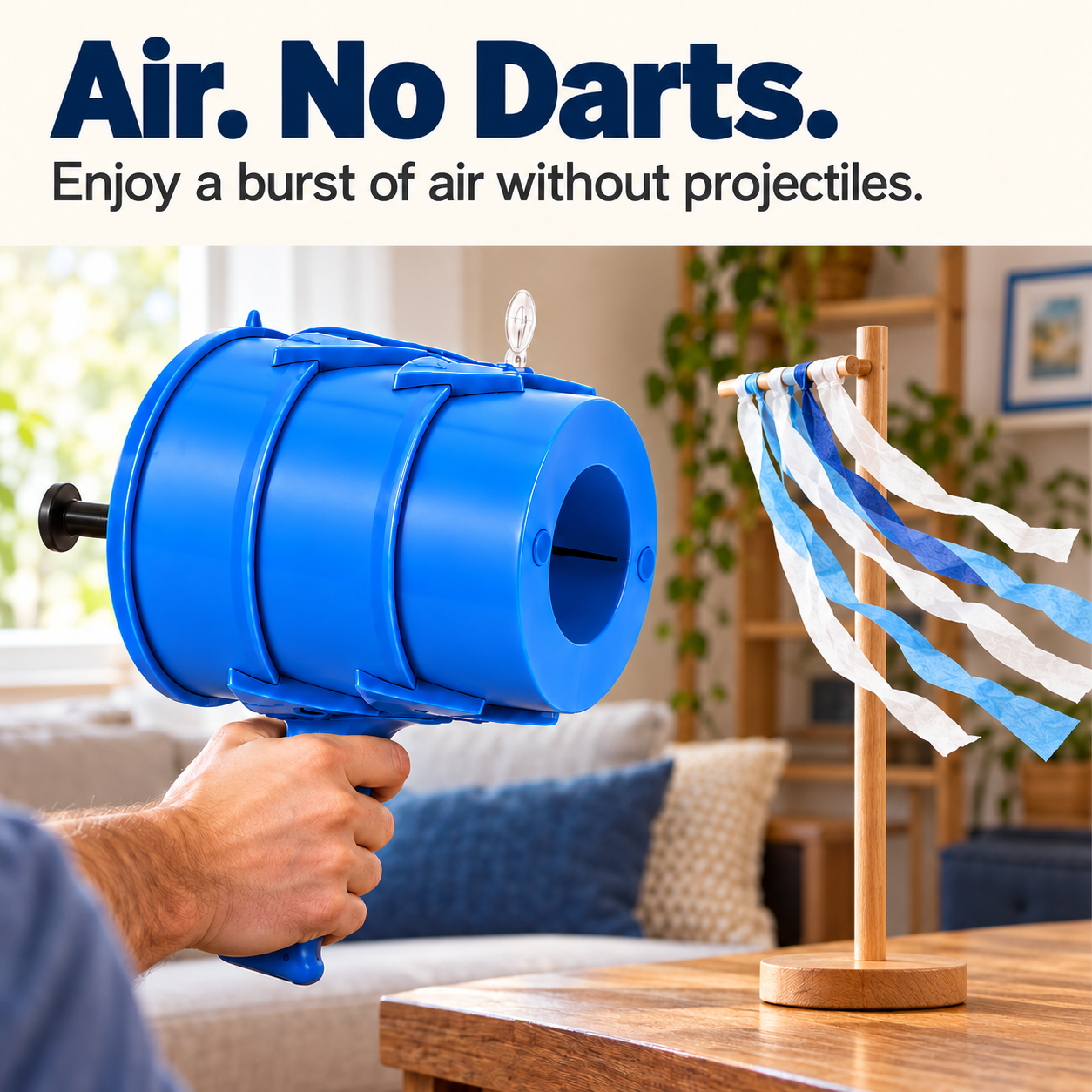 Blue air vortex toy directed toward lightweight paper streamers without projectiles