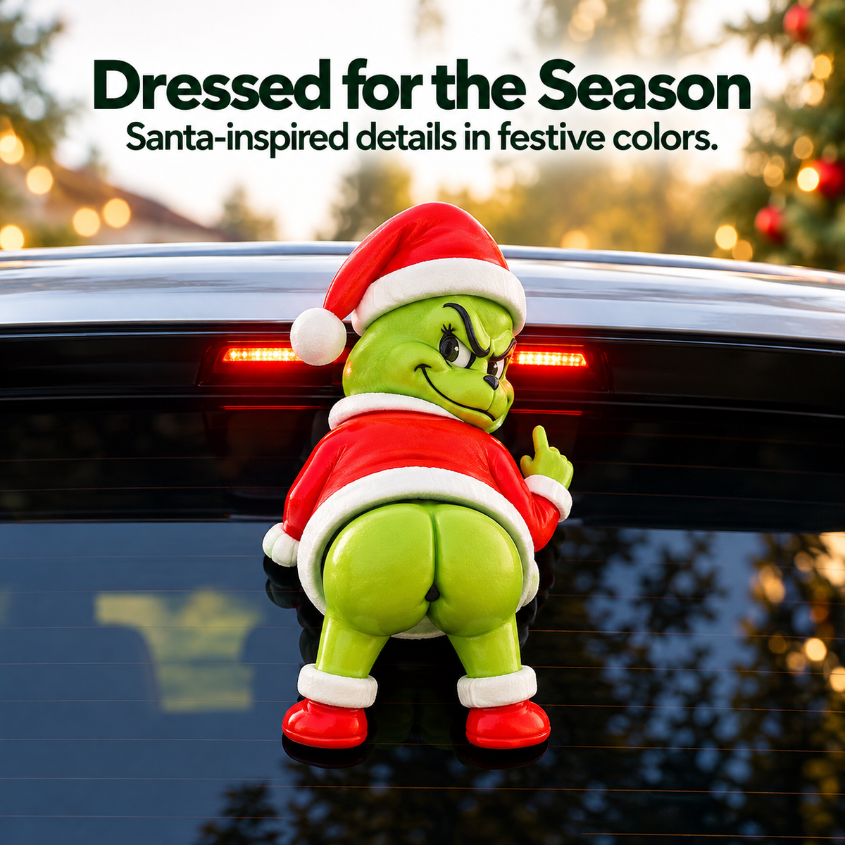 Rear view of the green Christmas character wearing a red Santa outfit