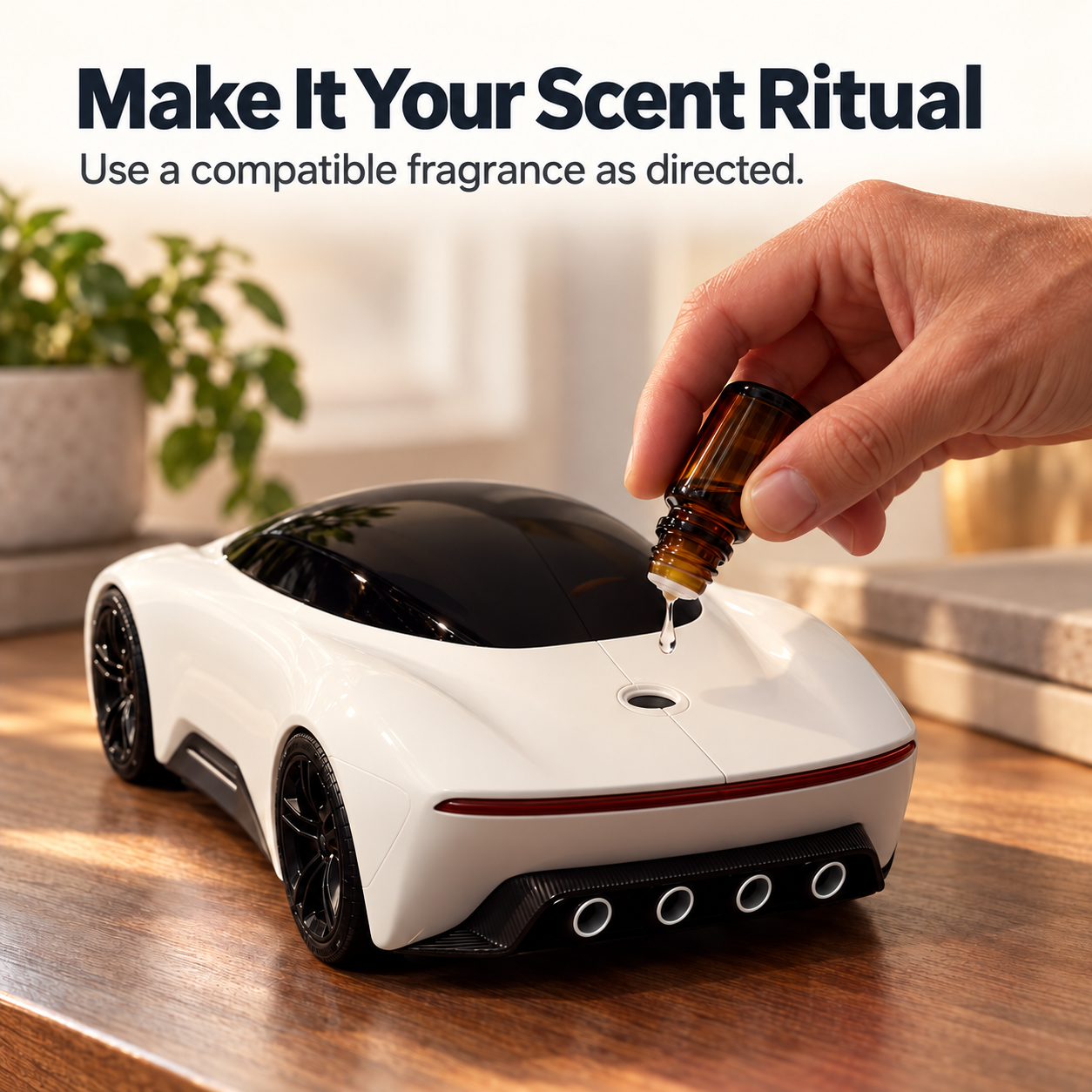 A compatible fragrance drop being added through the top rear opening