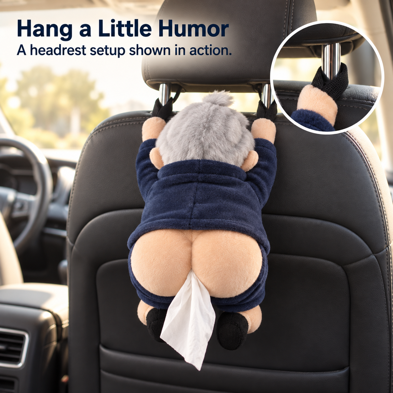 The holder hanging from two headrest attachment points in a parked car